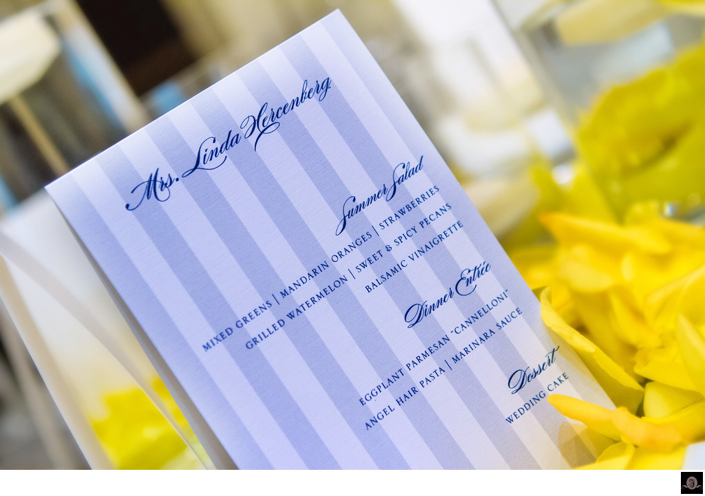 Blue and White Menu Card on yellow roses Photographs