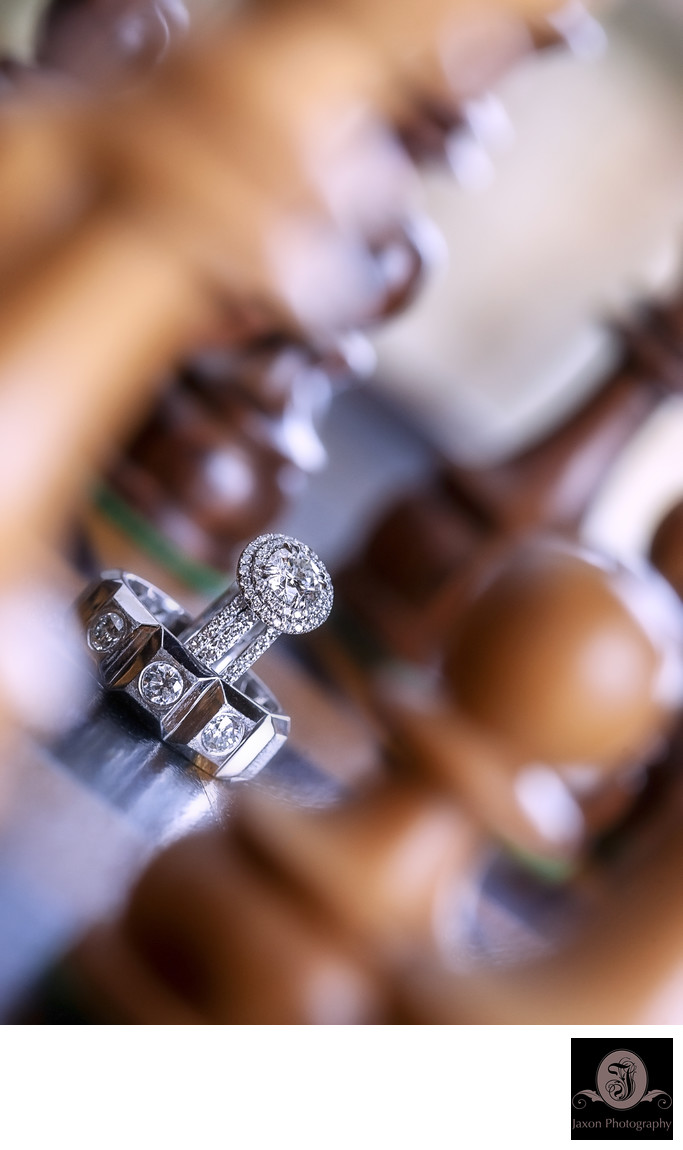 Chessboard Serenade: Creative Wedding Ring Photography