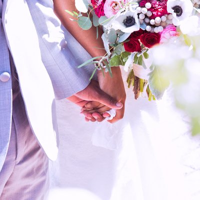 Emotive Moment: Bride & Groom's Fingers Intertwined