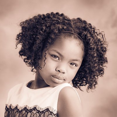 A portrait of a young girl having fun in studio | Jaxon photography