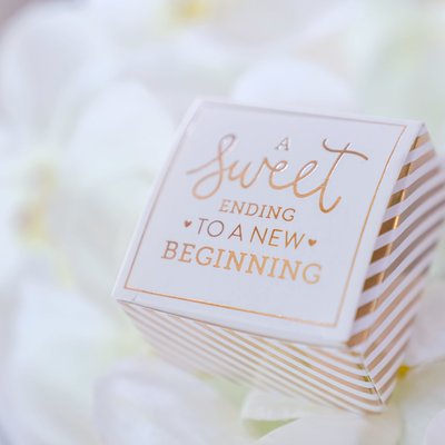 A Sweet Beginning: Wedding Favor Amidst Rose Petals