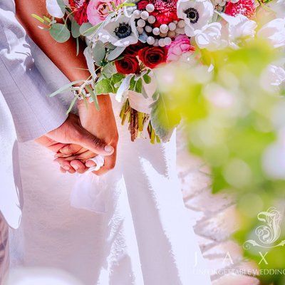 Intimate Wedding Moment: Of Couple Holding Hands