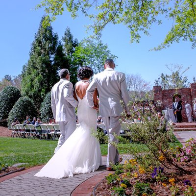 Dads escort the bride to the Carl House wedding.