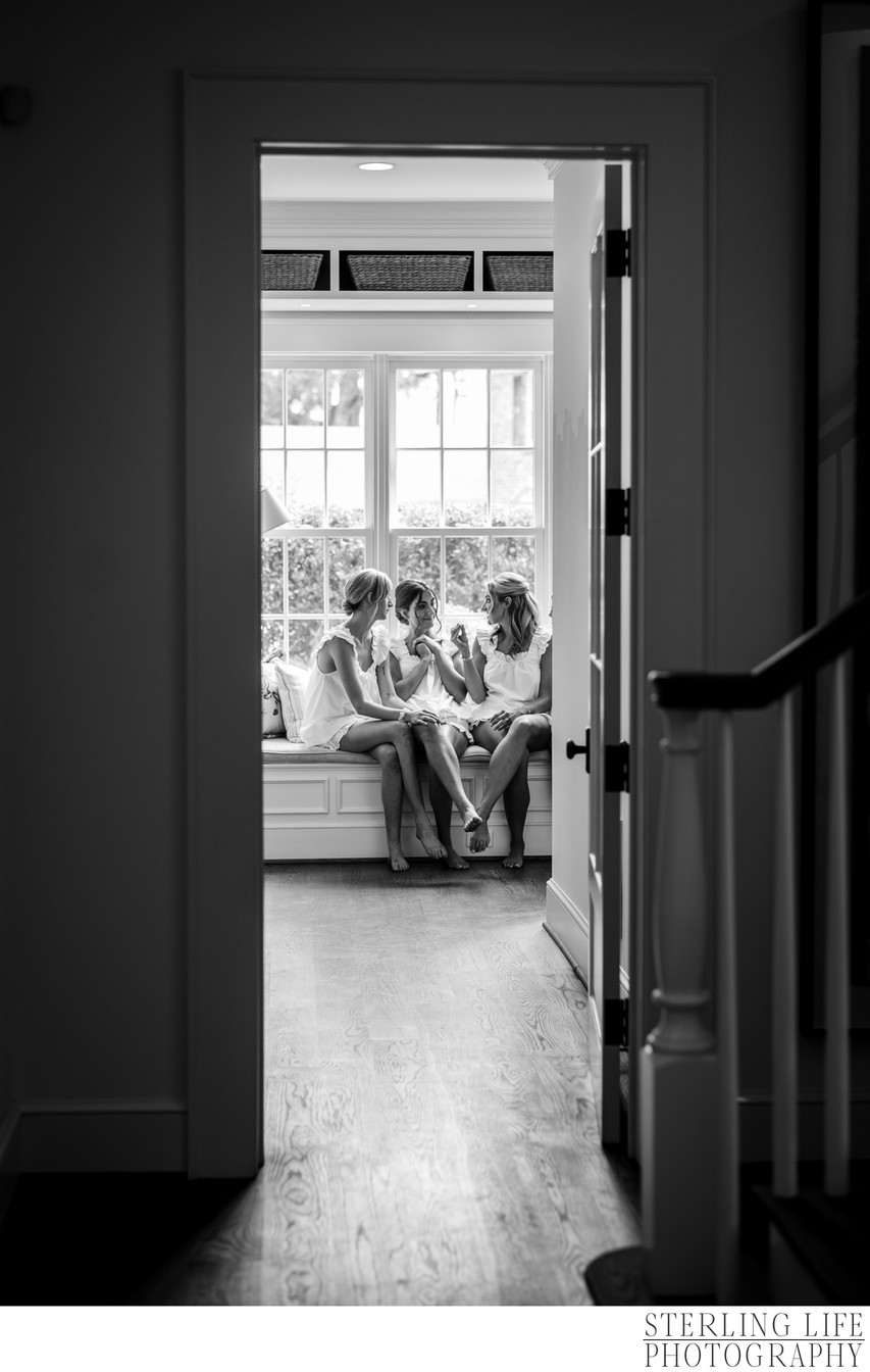 Bridesmaids talk with the bride on her wedding day