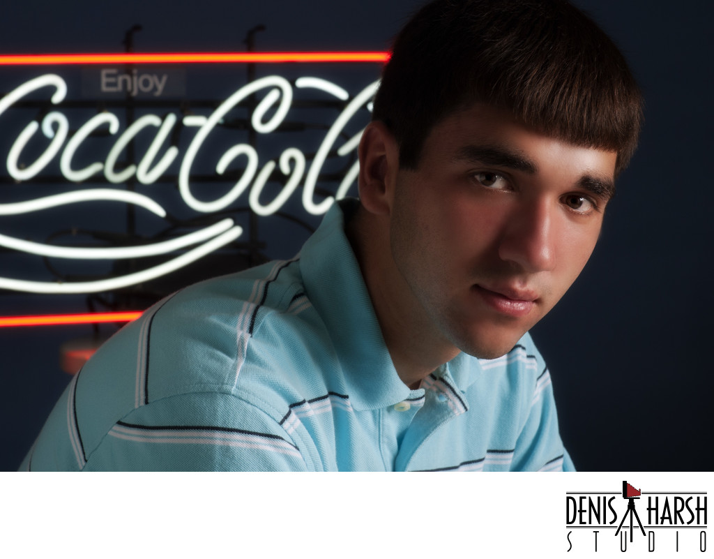 Bloomington Senior Pictures Boy with neon Coke sign