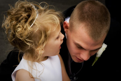 Cutest Flower Girl whispers question in her Dad's ear