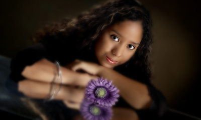 Dramatic Closeup Senior Portrait of Girl with flower