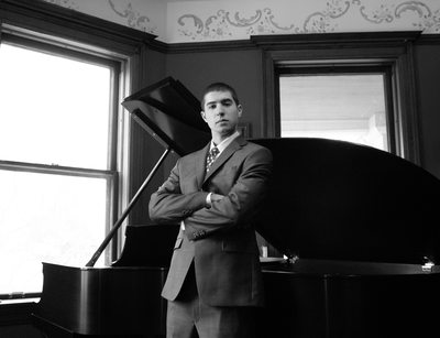 Senior Pictures Bloomington boy with Steinway Piano