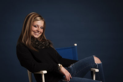 Normal Community West HS Senior Girl lounging on chair