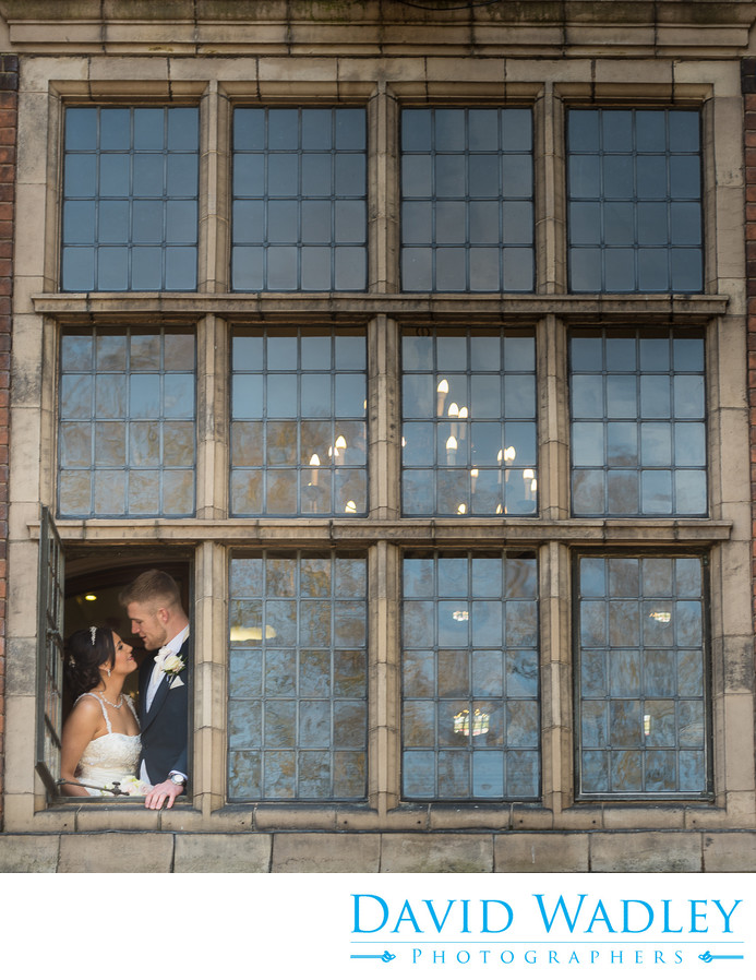 Bride & Groom in Window at Moxhull Hall on their Wedding Day