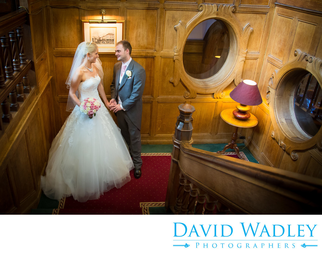 Bride & Groom photographed together on staircase at Moor Hall Hotel.