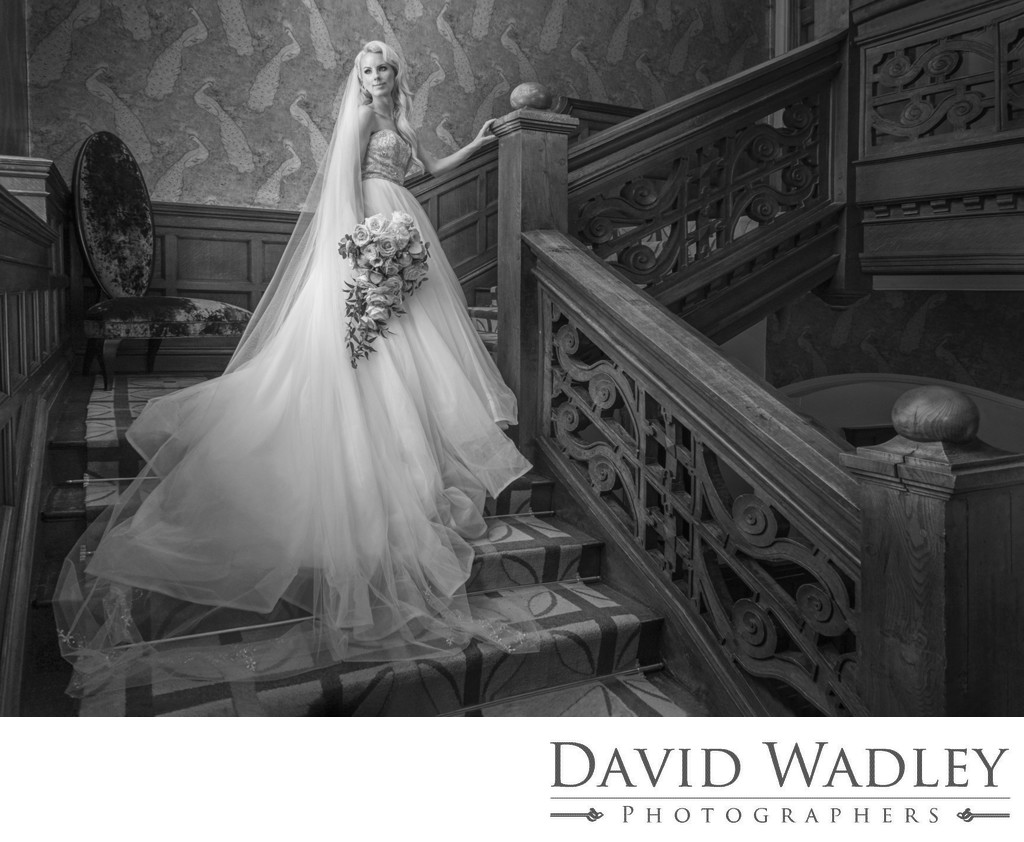Bride on stairs at Moxhull Hall
