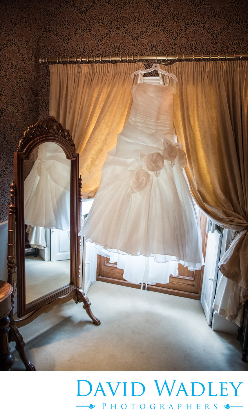 Wedding dress at Grafton Manor reflected in mirror.
