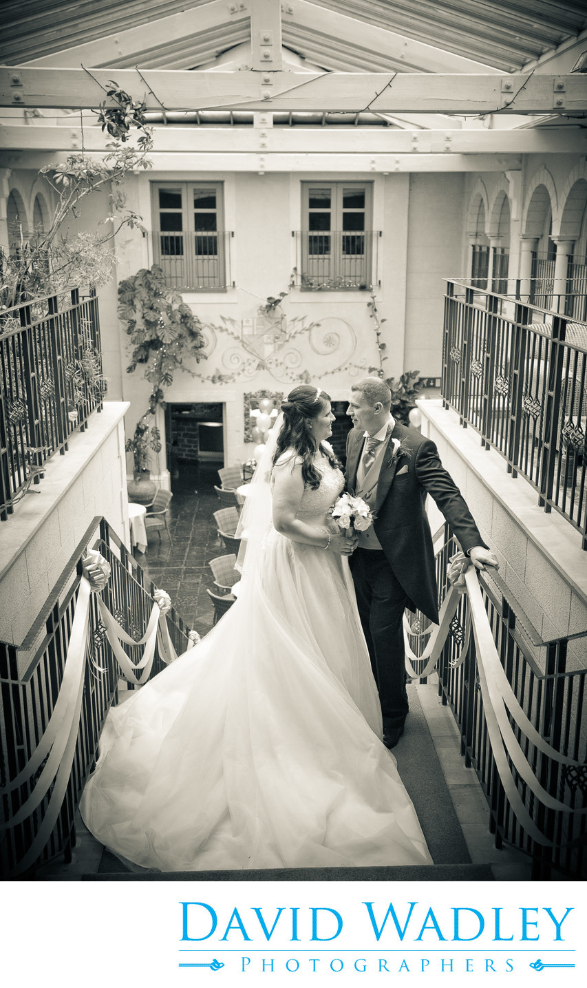 Bride & Groom at the top of the stairs at Nailcote Hall.