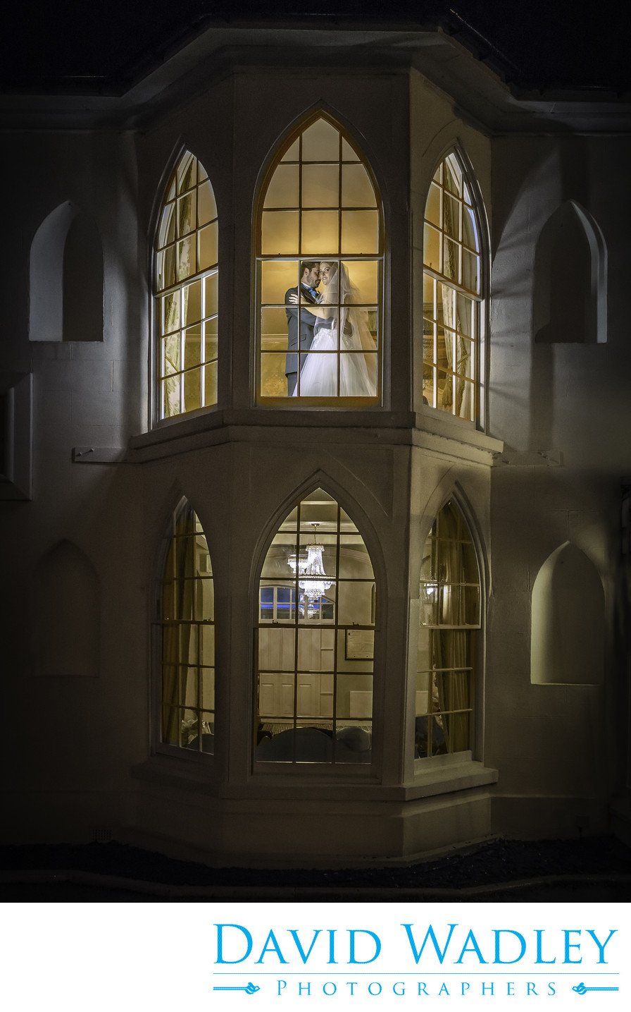 Bride & Groom in Windows at Warwick House