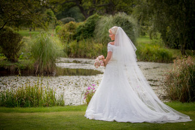The bride in the lovely gardens of Nailcote Hall.