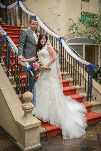 Bride & Groom on stairs at Nailcote Hall.