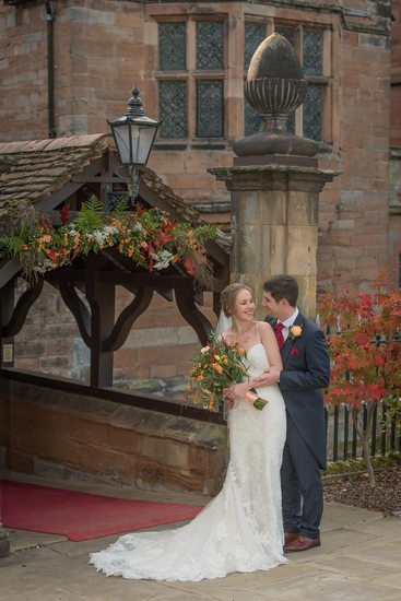 Bride & Groom photographed at front of New Hall Hotel in Sutton Coldfield.