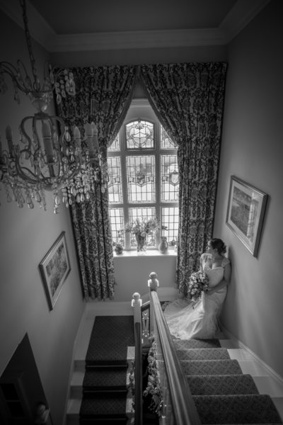 Bride on stairs at Grafton Manor.