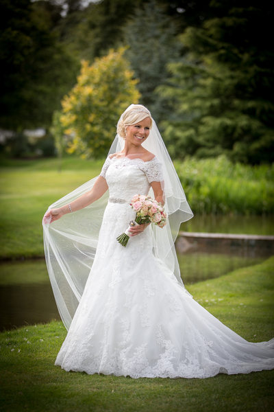 Bride in the  beautiful gardens at Nailcote Hall.