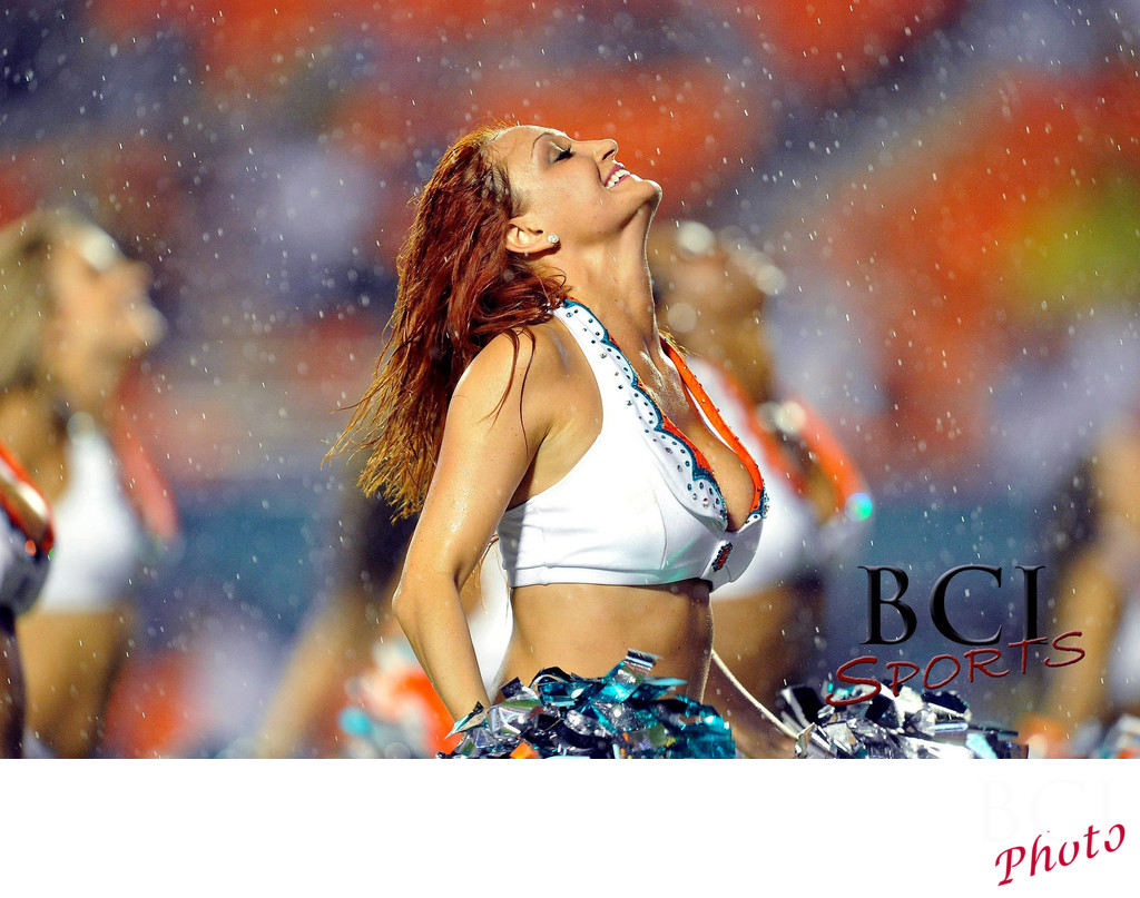 Miami Dolphins Cheerleaders perform in the rain
