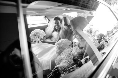 fun shot of the bride in her limo at the church