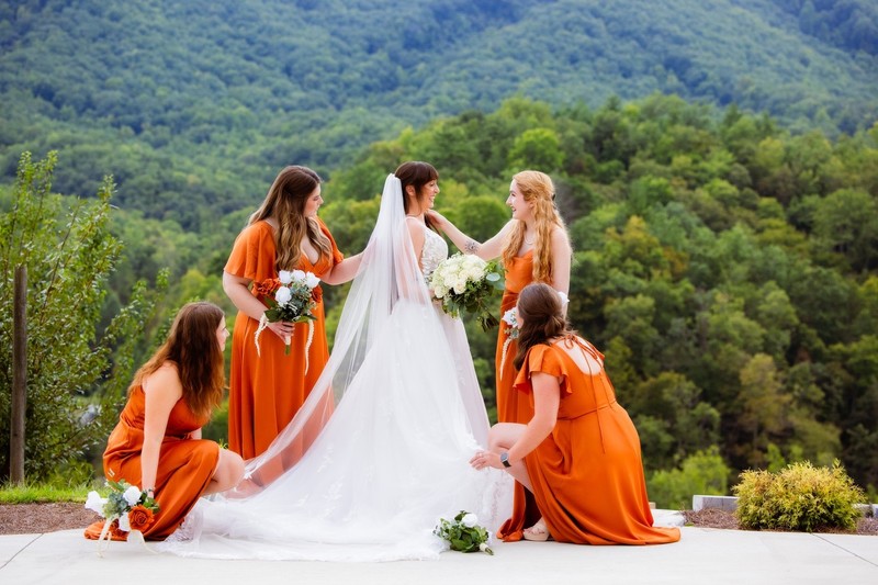 Bridesmaids Adjust Veil at Mountain Mist Farms