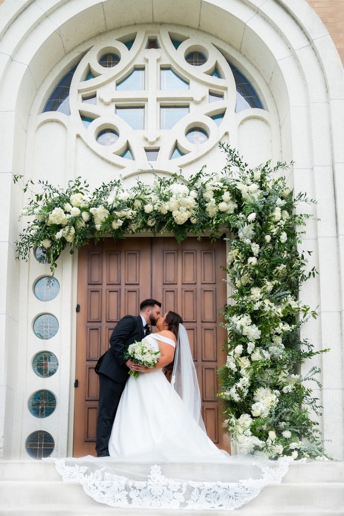 Newlyweds Kiss at Press Room Wedding