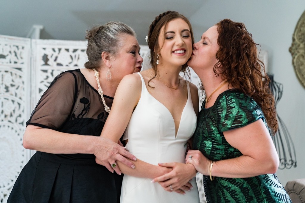 Sweet Kiss from Mom and family at Ramble Creek Wedding