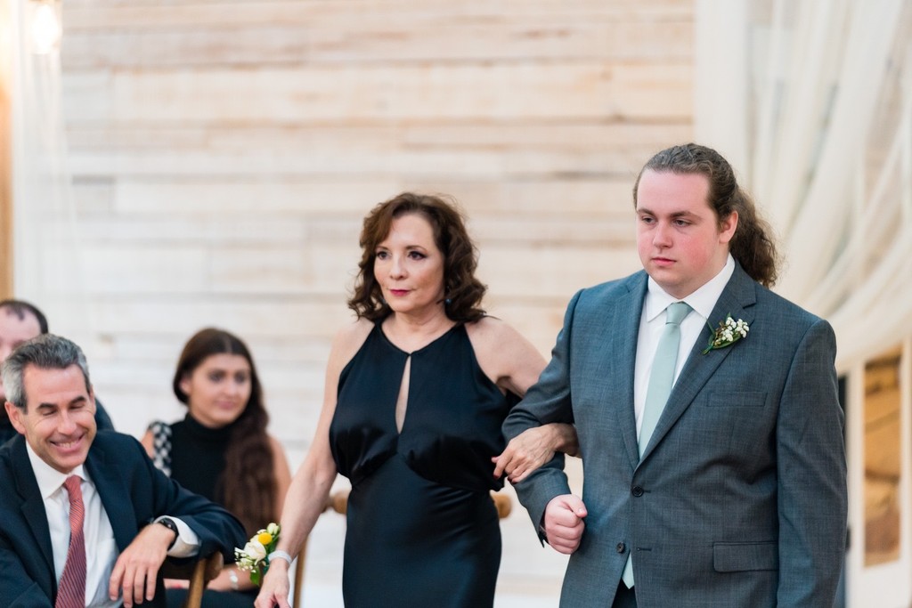 Groom's Brother Escorting Mother-In-Law Down the Aisle