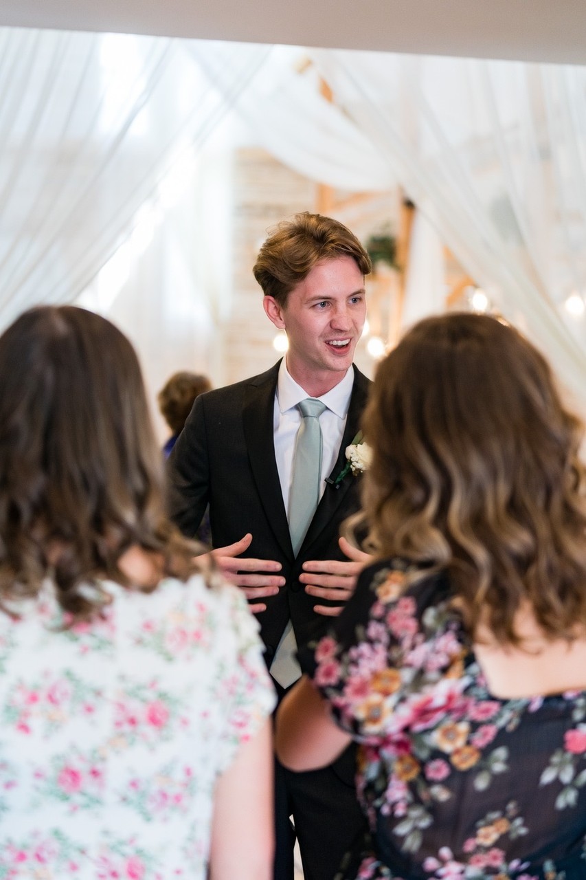 Groom Greets Guests during Ramble Creek Wedding