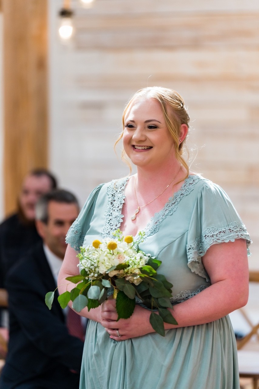 Smiling Bridesmaid with Spring Bouquet