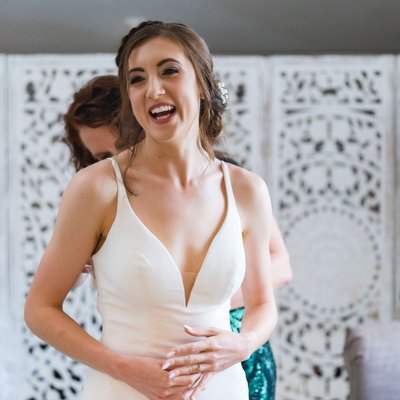 Bride Laughing During Prep at Ramble Creek