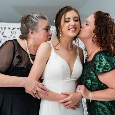 Sweet Kiss from Mom and family at Ramble Creek Wedding