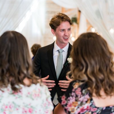 Groom Greets Guests during Ramble Creek Wedding