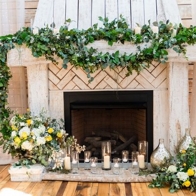 Ceremony Fireplace Decor at Ramble Creek Wedding Venue