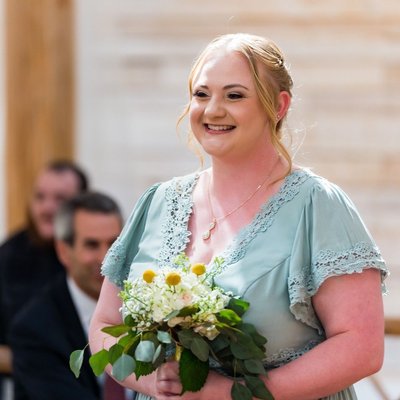 Smiling Bridesmaid with Spring Bouquet