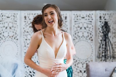 Bride Laughing During Prep at Ramble Creek