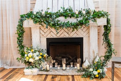 Ceremony Fireplace Decor at Ramble Creek Wedding Venue