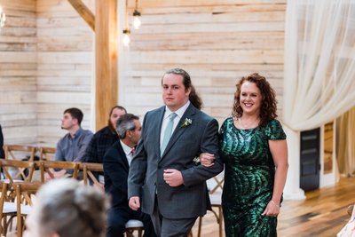 Groom's Brother Escorting Guest Down the Aisle