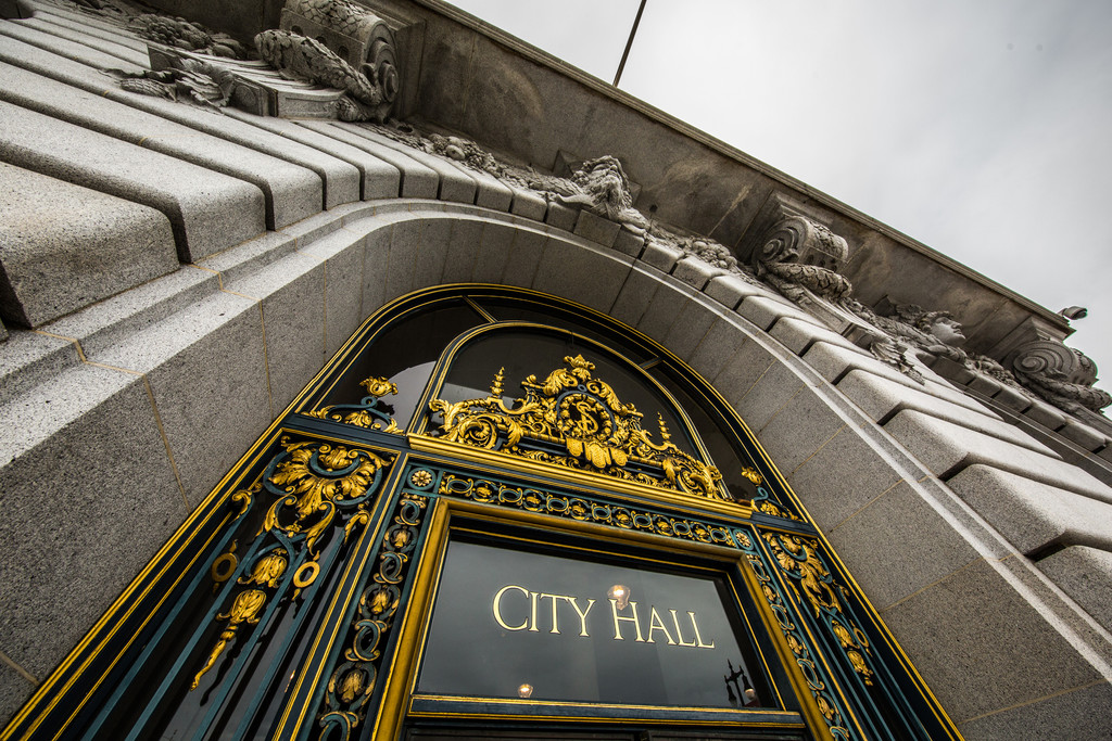 Wide angle view of City Hall doors sign