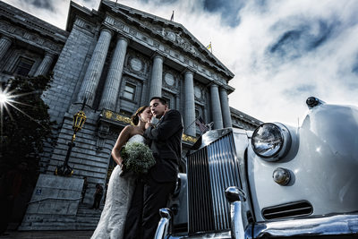 Bride, groom Rolls Royce in front of SF City Hall
