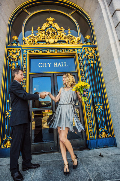 Bride in silver dress by City Hall doors