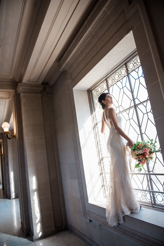 Natural light wedding moment inside San Francisco City Hall