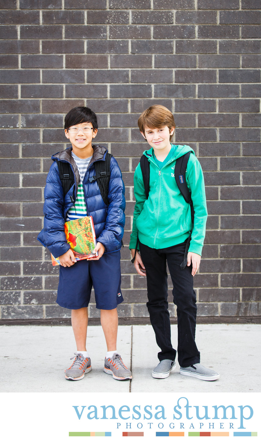 Outdoor portrait of two boys with backpacks