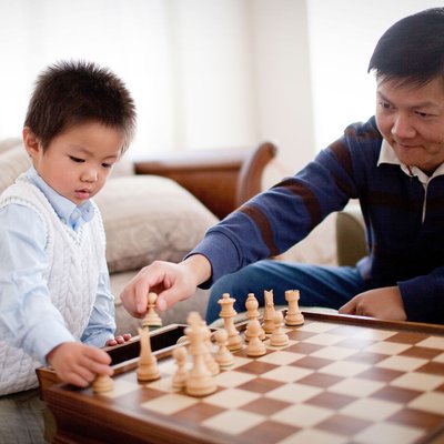 Milpitas son dad playing chess photo