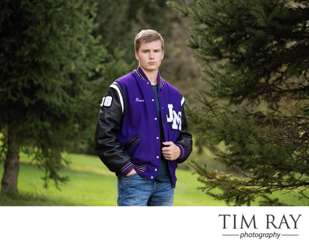 Senior boy in lettermen's jacket by wv senior portrait photographer Tim Ray