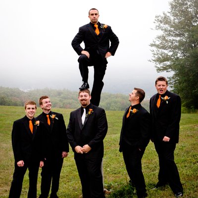 Funny photo of best man standing on groom's shoulder at Wisp Resort