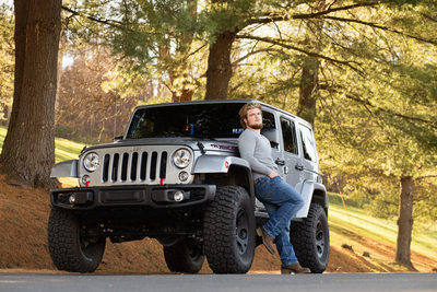 Senior Portrait of a boy with his Jeep