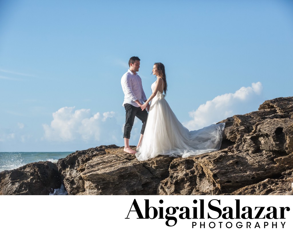 Trash the dress session: Bride and groom on an ocean cliff